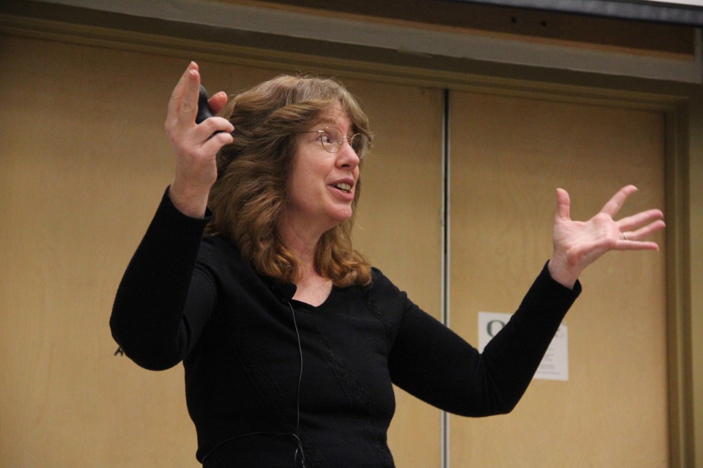 SLAC’s JoAnne Hewett gives her rendition of the dark matter rap, repeating the refrain: “Dark matter: what is it?”.  Image: Jack Liu.