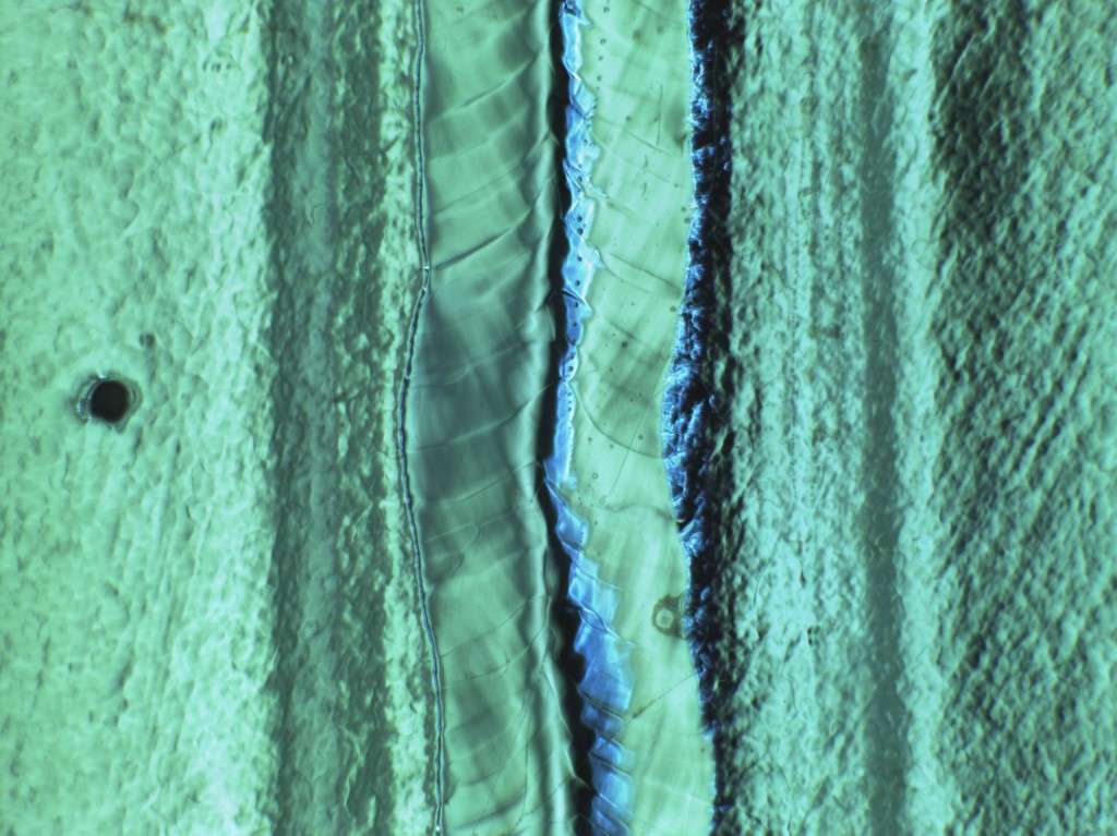 This 'crater' on the left hand side of the picture would almost certainly lead to a quench very quickly. The 'Kyoto camera' spotted this spot on a cavity's interior surface. It's a remnant from the production process that couldn't be eliminated during surface treatment, which led to the chemicals reacting with the surface in a different way than normal and causing the crater. In fact the cavity quenches at 13 MV/m.