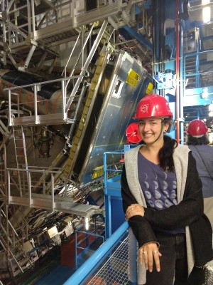 Amanda Steinhebel stands near the ATLAS detector at CERN's Large Hadron Collider.
